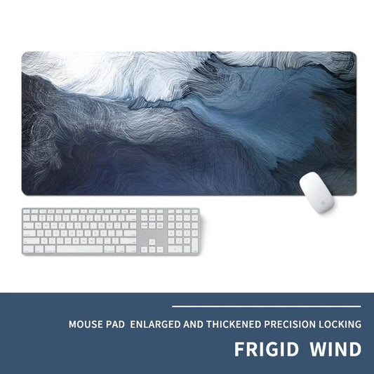 Mouse pad with abstract design, keyboard, and mouse on a white background, featuring the brand 'Frigid Wind'.