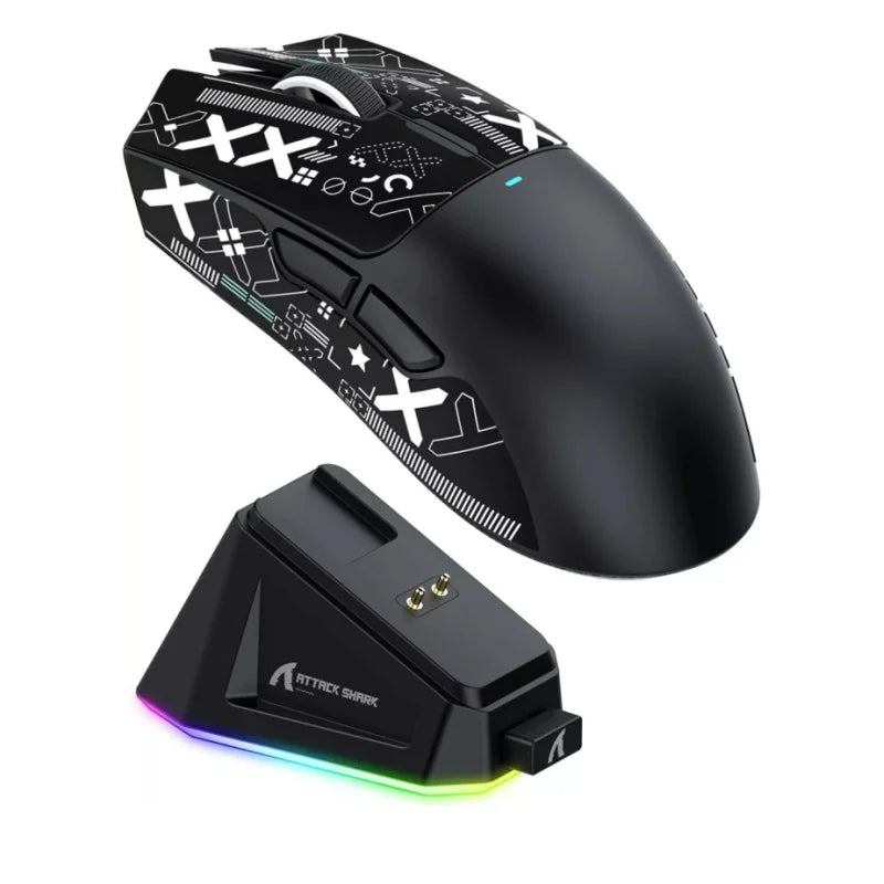 Gaming mouse with charging base on a white background